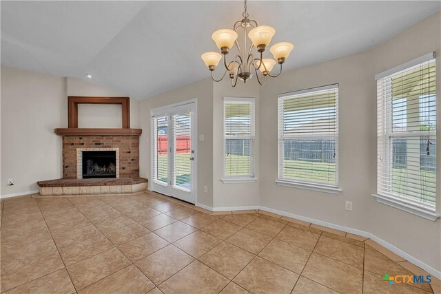 2922 Starlight Dr, Copperas Cove, TX 76522 - unfurnished living room featuring light tile patterned floors, a chandelier, vaulted ceiling, a brick fireplace, and baseboards