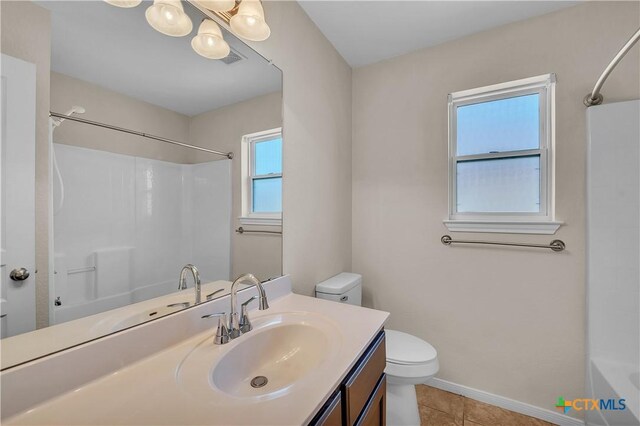 2922 Starlight Dr, Copperas Cove, TX 76522 - full bathroom with toilet, vanity, bathing tub / shower combination, tile patterned flooring, and baseboards