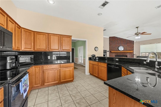 4501 Arrowhead Dr, Temple, TX 76502 - kitchen featuring black appliances, decorative backsplash, ceiling fan, light tile patterned floors, and dark stone countertops