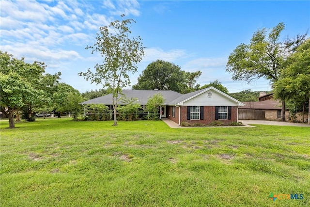 4501 Arrowhead Dr, Temple, TX 76502 - ranch-style home featuring brick siding and a front lawn