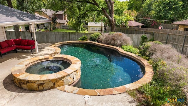 4501 Arrowhead Dr, Temple, TX 76502 - view of pool with a fenced backyard, a pool with connected hot tub, and a patio