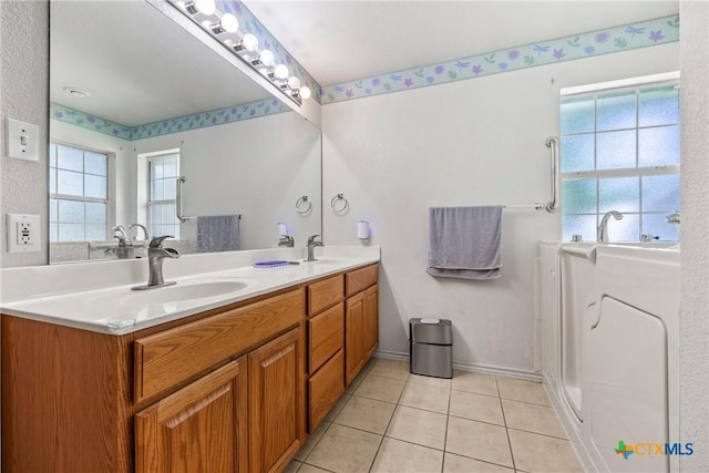 4501 Arrowhead Dr, Temple, TX 76502 - full bath featuring healthy amount of natural light, double vanity, and tile patterned flooring