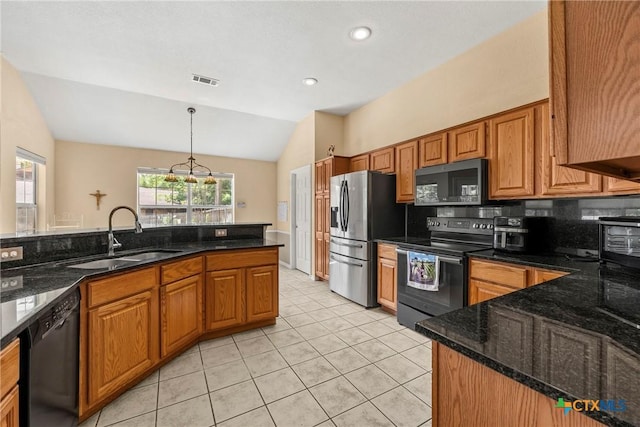 4501 Arrowhead Dr, Temple, TX 76502 - kitchen with range with electric stovetop, black dishwasher, stainless steel fridge, vaulted ceiling, and brown cabinetry