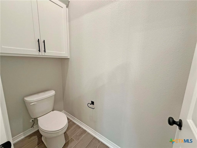 2021 Yarrow Rd, Temple, TX 76502 - bathroom featuring toilet and wood tiled floors