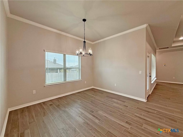 2021 Yarrow Rd, Temple, TX 76502 - unfurnished room featuring wood finished floors, crown molding, and a chandelier