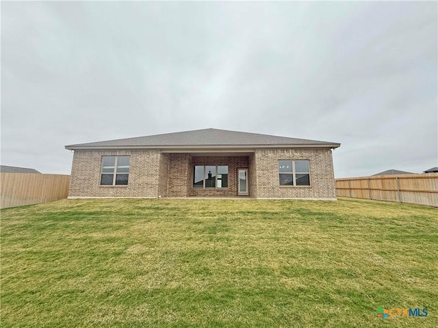 2021 Yarrow Rd, Temple, TX 76502 - back of house with brick siding and a fenced backyard