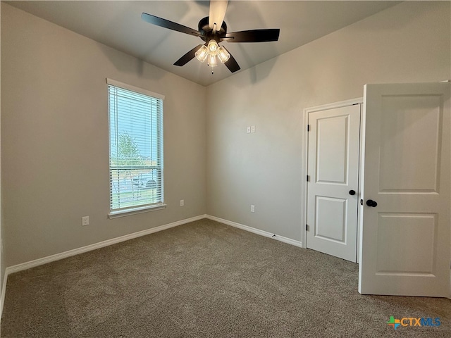 carpeted empty room with ceiling fan