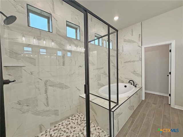 2021 Yarrow Rd, Temple, TX 76502 - bathroom with a garden tub, a shower stall, recessed lighting, and wood finished floors