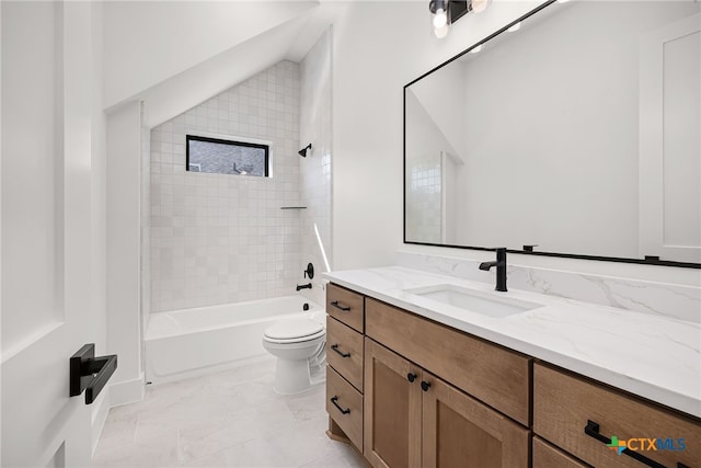 full bathroom with lofted ceiling, toilet, tile patterned flooring, tiled shower / bath combo, and vanity