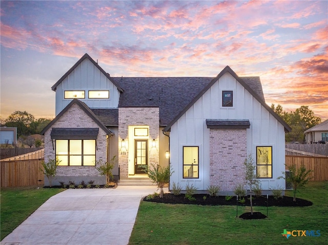 modern farmhouse with a yard