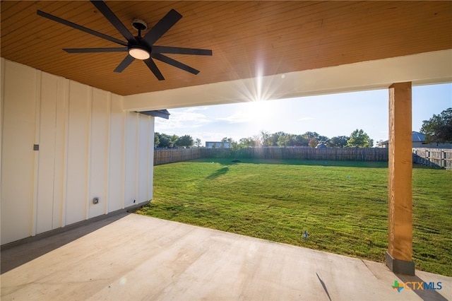 view of yard featuring ceiling fan and a patio area