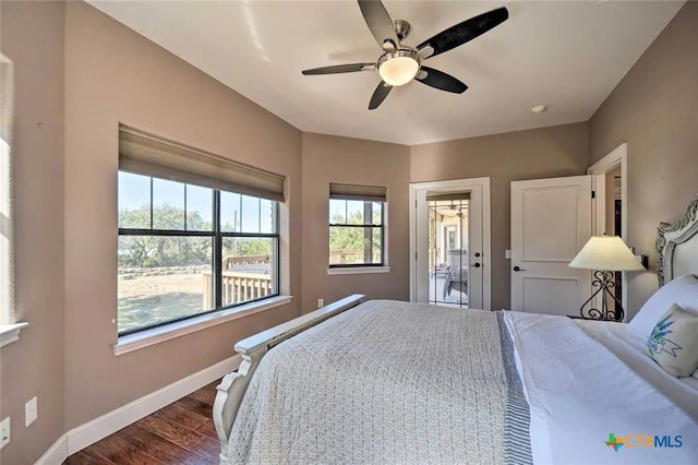 bedroom with ceiling fan and dark wood-type flooring