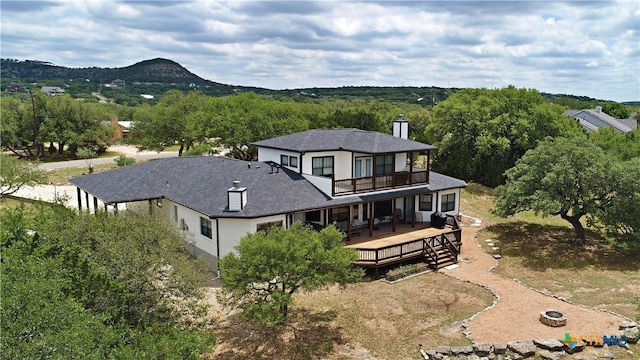 birds eye view of property featuring a mountain view