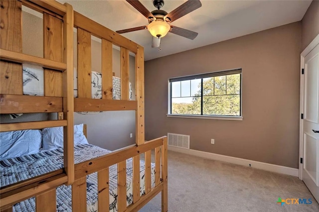 carpeted bedroom featuring ceiling fan