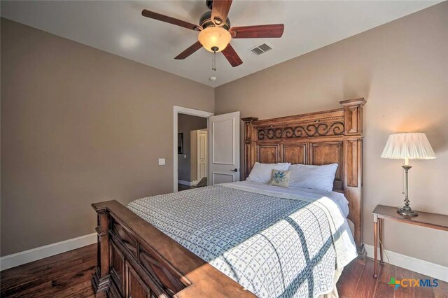 bedroom featuring ceiling fan and dark wood-type flooring