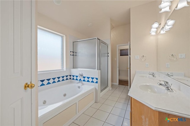 bathroom with tile patterned floors, shower with separate bathtub, and vanity