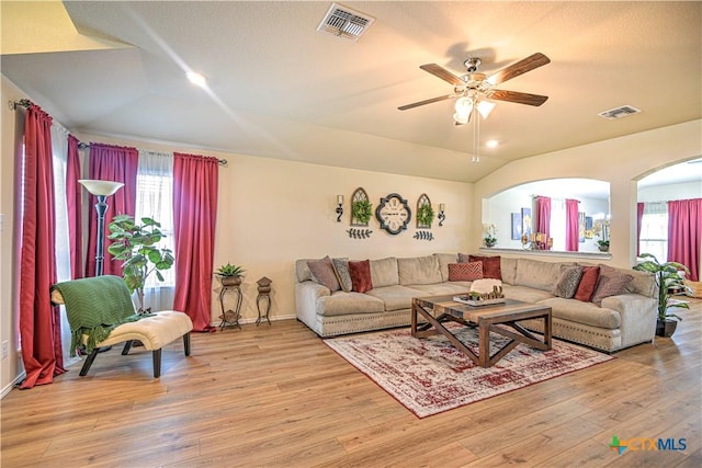 9300 Vaquero Way, Killeen, TX 76542 - living area featuring light wood-type flooring, vaulted ceiling, ceiling fan, baseboards, and arched walkways