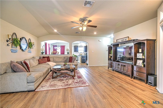 9300 Vaquero Way, Killeen, TX 76542 - living area featuring a ceiling fan, light wood finished floors, arched walkways, lofted ceiling, and baseboards