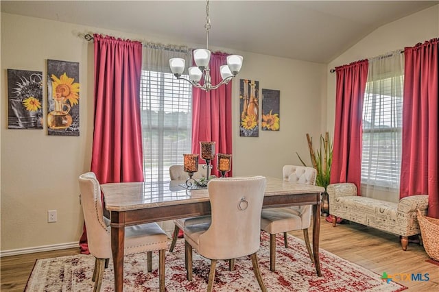 9300 Vaquero Way, Killeen, TX 76542 - dining space featuring a chandelier, plenty of natural light, wood finished floors, vaulted ceiling, and baseboards