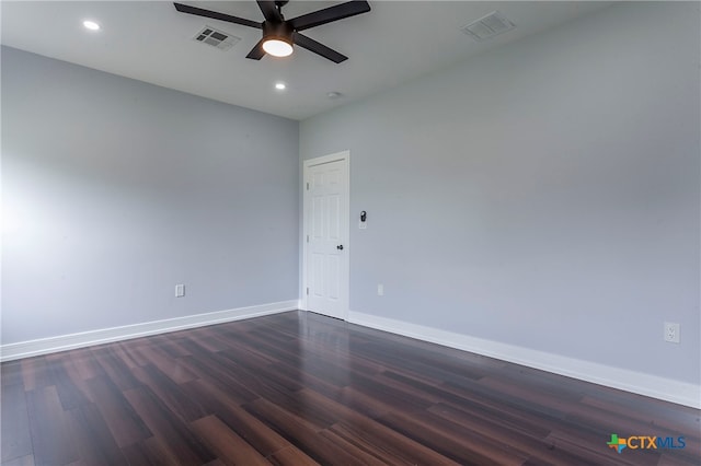 unfurnished room featuring dark wood-type flooring and ceiling fan