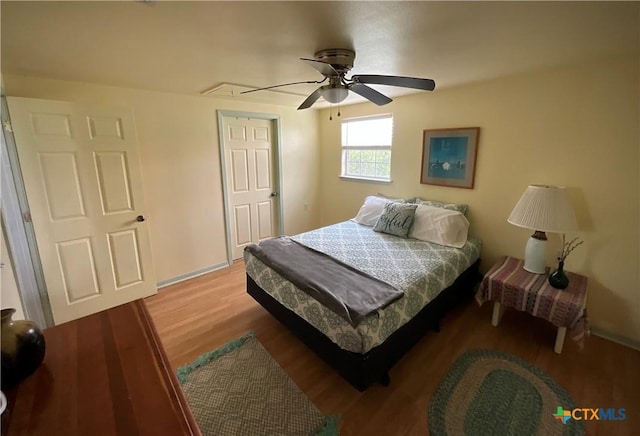 364 N Blackburn Ave, Port Lavaca, TX 77979 - bedroom with attic access, wood finished floors, ceiling fan, and baseboards