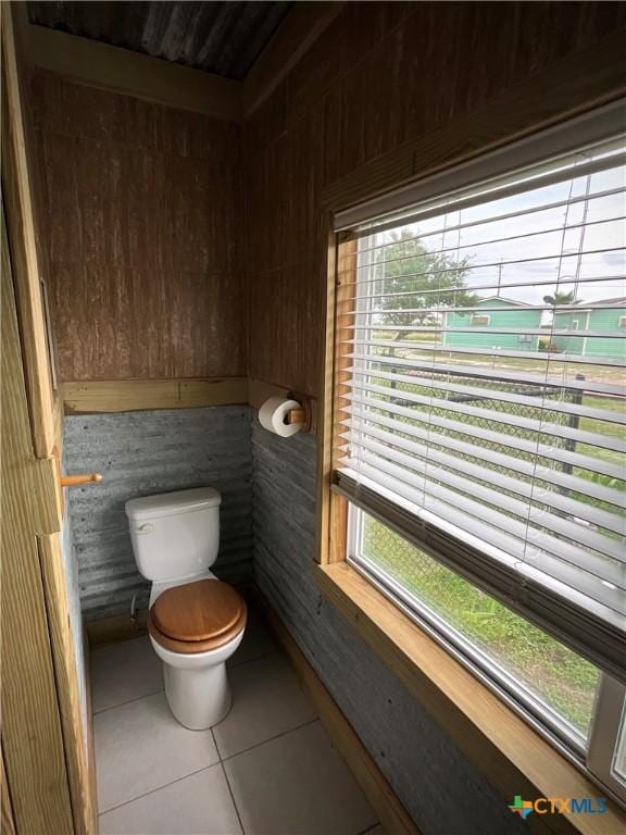 364 N Blackburn Ave, Port Lavaca, TX 77979 - bathroom with toilet, tile patterned flooring, and plenty of natural light