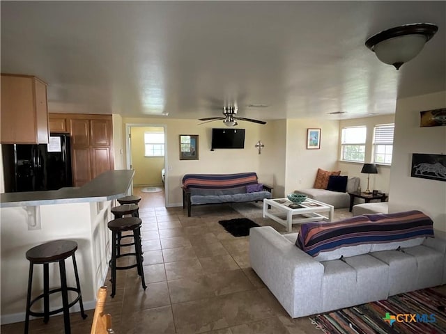364 N Blackburn Ave, Port Lavaca, TX 77979 - living area with tile patterned flooring, ceiling fan, and baseboards