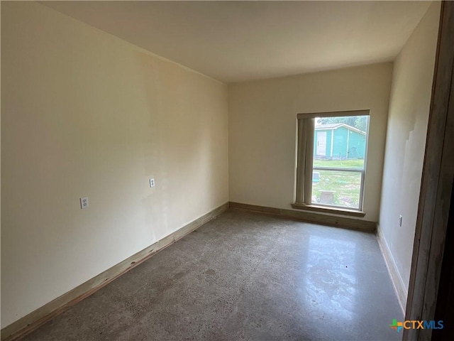 364 N Blackburn Ave, Port Lavaca, TX 77979 - empty room with concrete flooring and baseboards