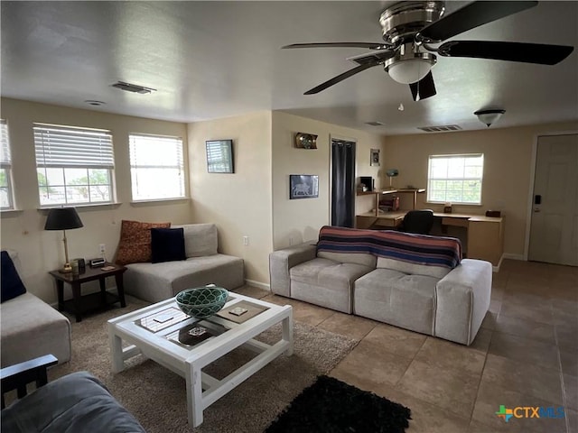 364 N Blackburn Ave, Port Lavaca, TX 77979 - living area featuring ceiling fan, tile patterned floors, and baseboards
