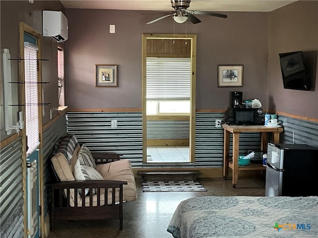 364 N Blackburn Ave, Port Lavaca, TX 77979 - bedroom with freestanding refrigerator, an AC wall unit, and a wainscoted wall