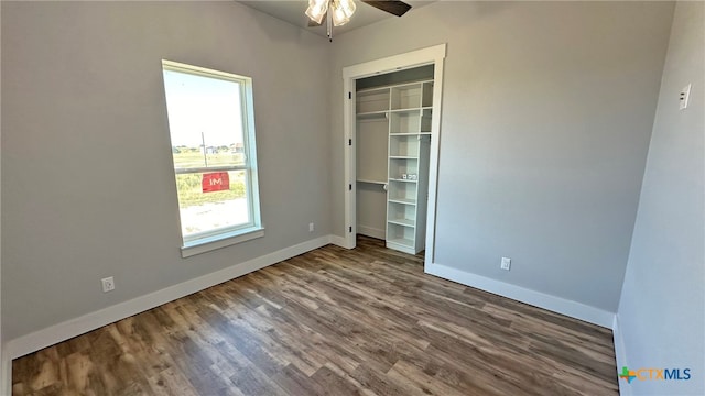 spare room featuring hardwood / wood-style floors and ceiling fan