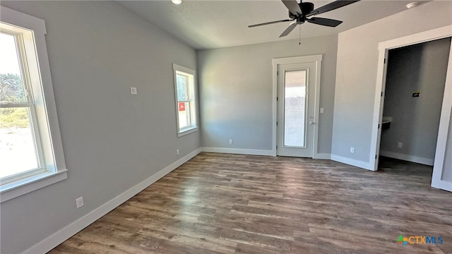 interior space with hardwood / wood-style floors, a wealth of natural light, and ceiling fan