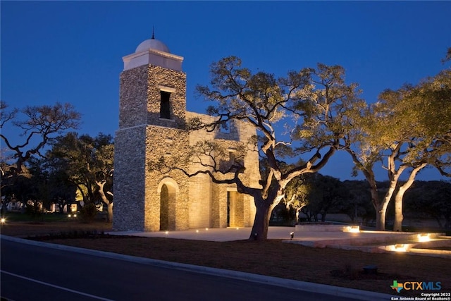 129 La Cima, Boerne, TX 78006 - view of side of property with stone siding