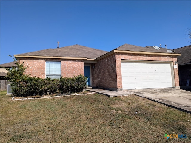 single story home with a garage and a front lawn