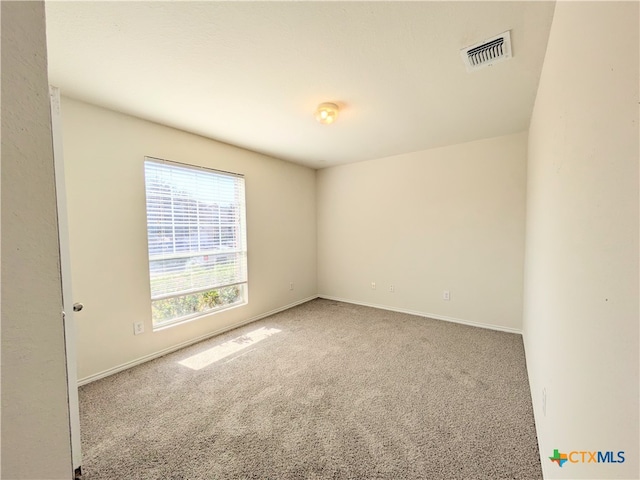 view of carpeted spare room