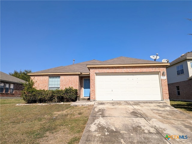 view of front of house featuring a garage and a front yard