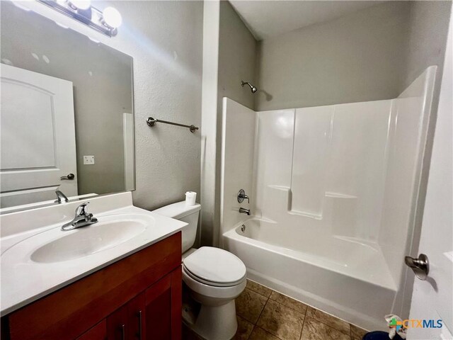 313 Rorem Ave, Palacios, TX 77465 - full bath featuring toilet, tile patterned flooring, bathtub / shower combination, and vanity
