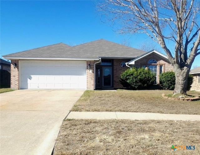 single story home featuring a garage