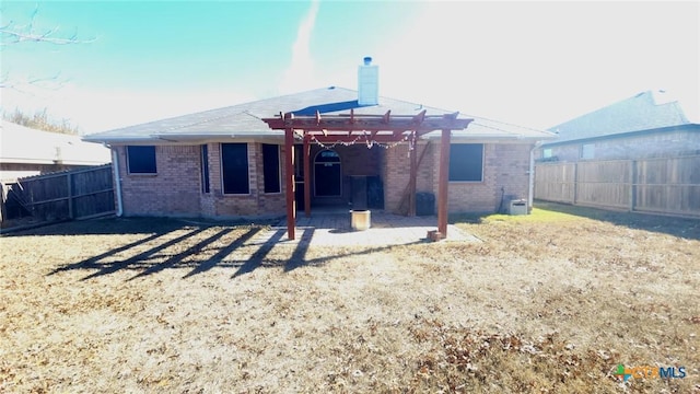 rear view of property featuring a pergola