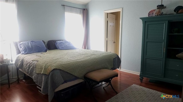 bedroom featuring dark wood-type flooring