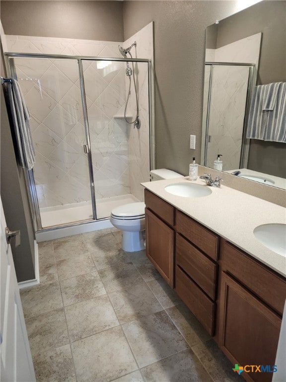 1306 Daniel Dr, Belton, TX 76513 - full bath featuring a shower stall, toilet, and double vanity