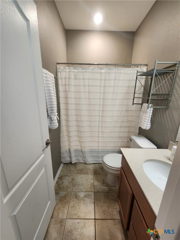 1306 Daniel Dr, Belton, TX 76513 - full bathroom featuring toilet, vanity, a textured wall, and a shower with shower curtain