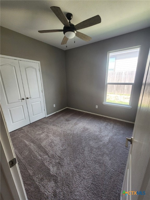 1306 Daniel Dr, Belton, TX 76513 - unfurnished bedroom with carpet floors, baseboards, a ceiling fan, and a closet