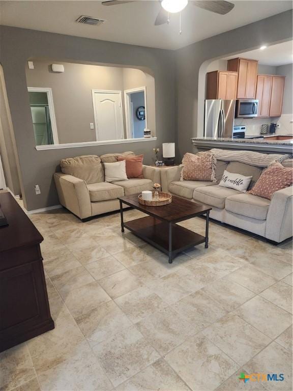 1306 Daniel Dr, Belton, TX 76513 - living area with ceiling fan and arched walkways