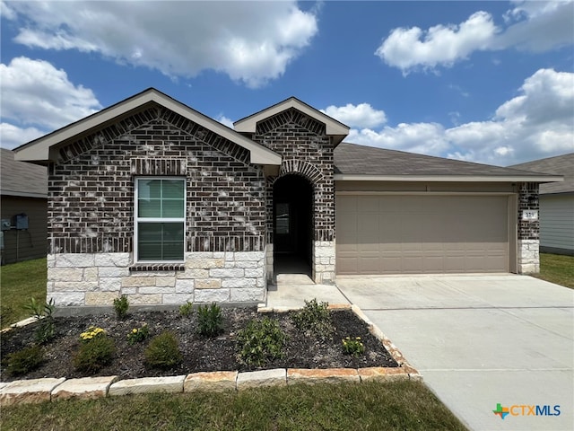 view of front of property featuring a garage