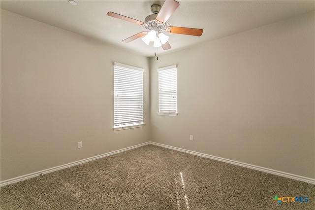 empty room featuring ceiling fan and carpet floors