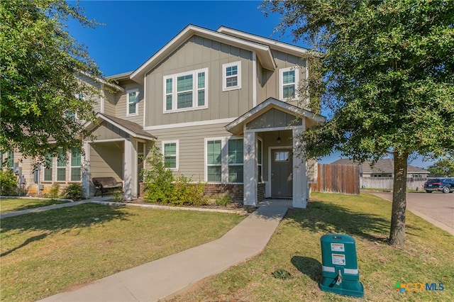 craftsman-style house with a front yard