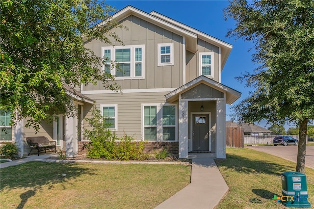 craftsman house with a front lawn