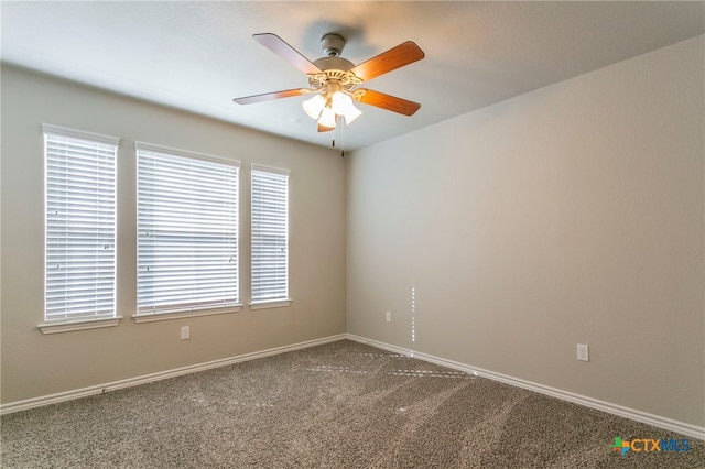 empty room featuring carpet flooring and ceiling fan