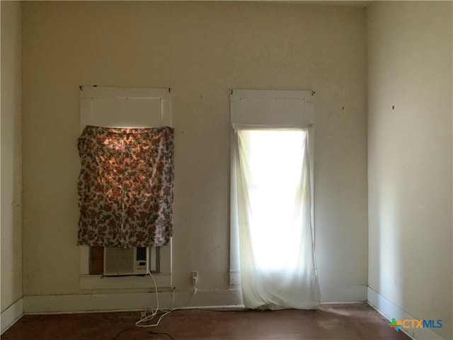 unfurnished room with cooling unit